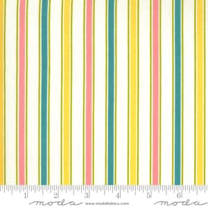 May include: White fabric with vertical stripes in yellow, pink, and teal. The fabric is measured in inches with the text "moda" printed on the ruler.