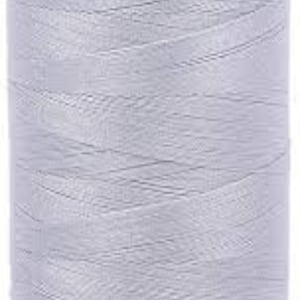 May include: A spool of light gray thread with an orange plastic top and a red plastic bottom.