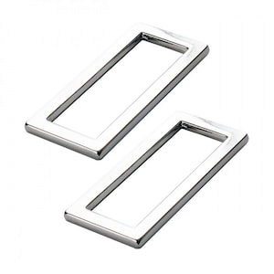 May include: Two silver metal rectangular rings, each with a smooth, polished finish. The rings are positioned at an angle to each other.