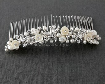 May include: Silver hair comb with white pearl and rhinestone embellishments, featuring starfish and flower designs.
