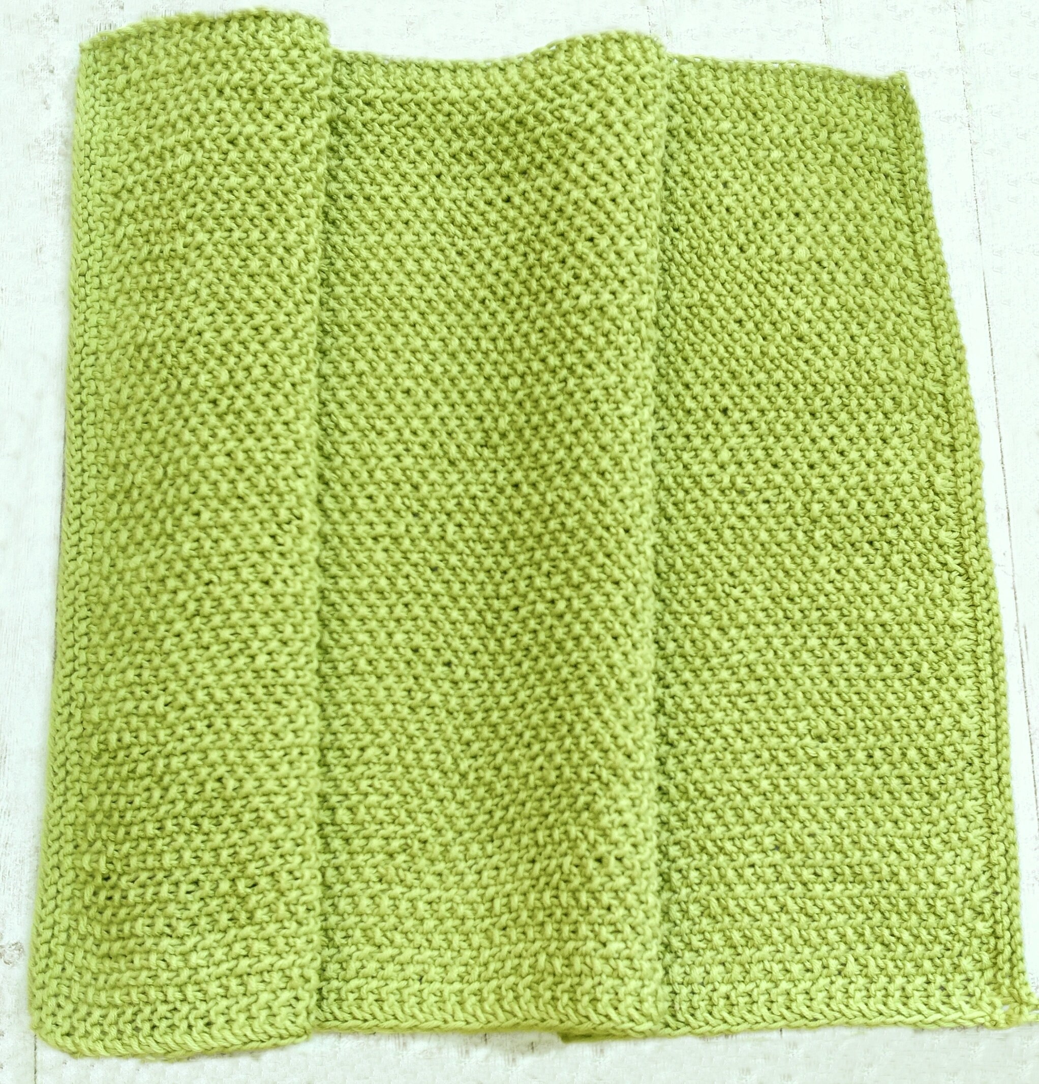 Связанная полотенцами. Вязаные полотенца. Трикотажные полотенца. Зеленое полотенце для рук. Вязаные полотенца для кухни.