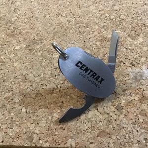 Key ring tool embossed as shown