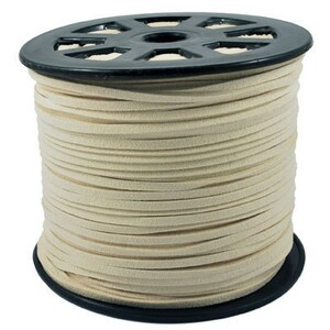 May include: A spool of off-white suede cord, wound tightly on a black plastic spool.