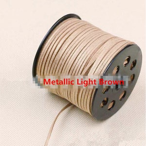 May include: A spool of metallic light brown leather cord. The cord is wound around a black plastic spool with holes for easy dispensing.