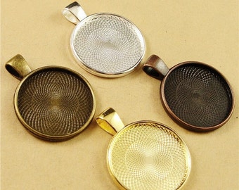 May include: Four round pendant trays with a silver, gold, bronze, and black finish. Each tray has a decorative swirl pattern.