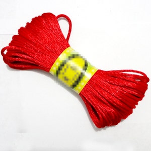 May include: A spool of red cord with a yellow label that says "2mm".