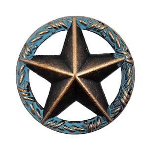 May include: A rustic, antique-looking metal Texas star with a turquoise blue rope design around the edge.