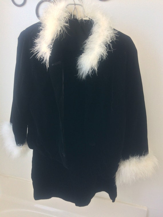 Feather trimmed velvet jacket and skirt