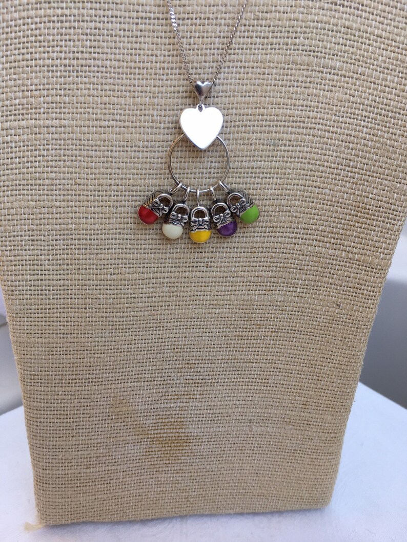 Sterling chain with charm holder and five enameled sneakers
