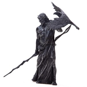 May include: A black and silver statue of a figure holding a spear and a raven. The figure is wearing a flowing robe and has a stern expression.