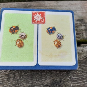 Carte da gioco vintage Muller & Cie Schaffhouse, realizzate in Svizzera, raffiguranti coccinelle e uccelli.
