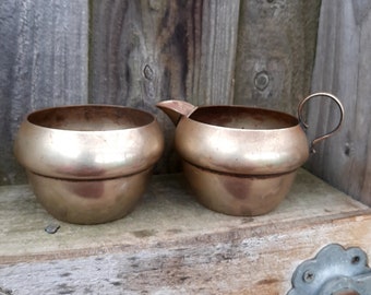 Vintage rustic silver plated copper cream jug and open sugar bowl