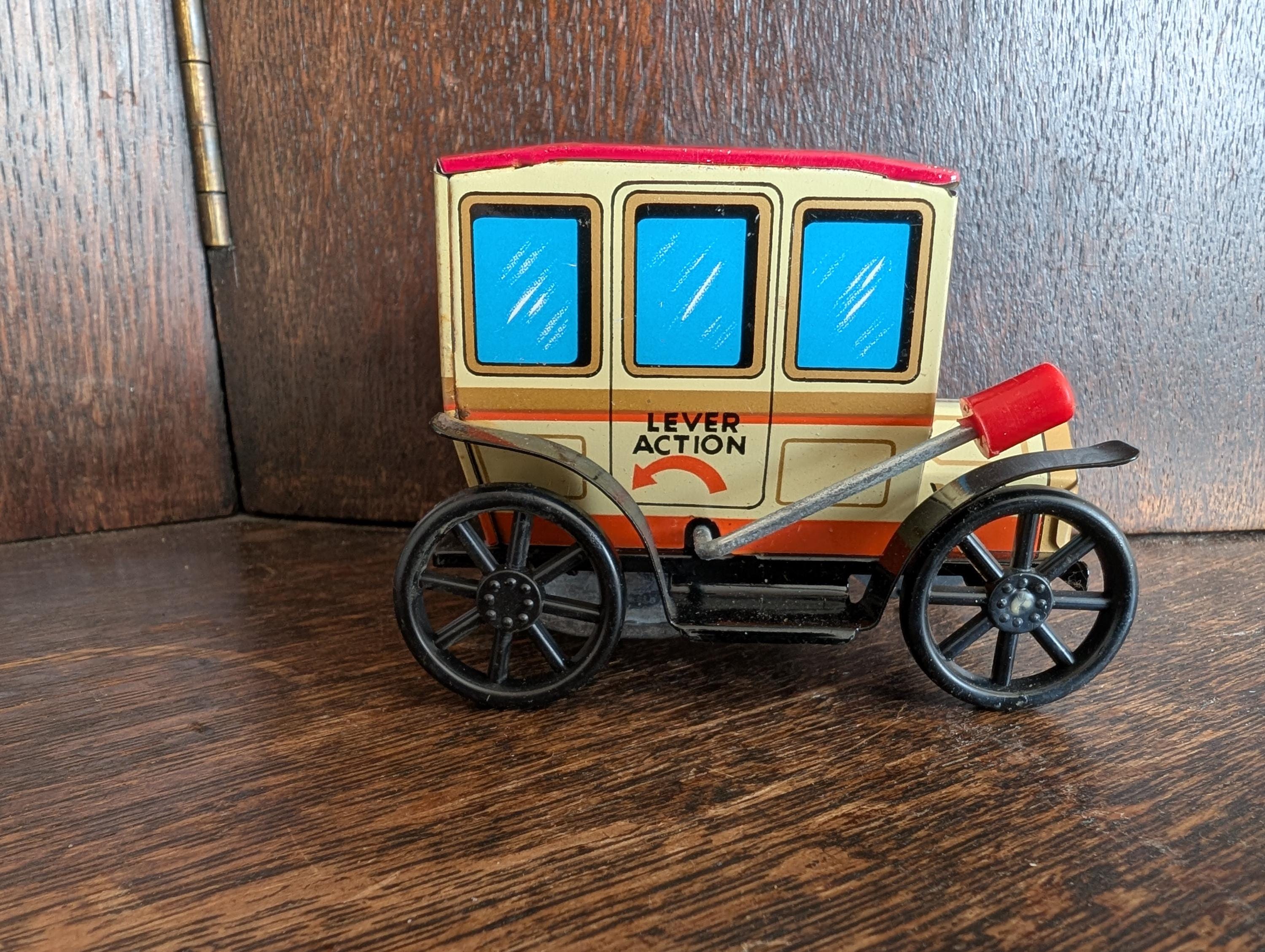 Vintage Japanese wind up tin car toy Mighty Midget
