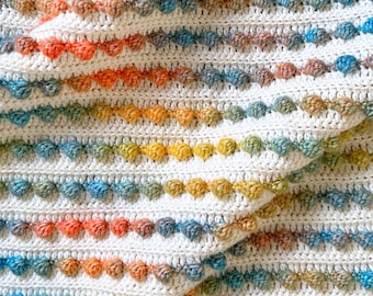 Patrón de crochet para manta de bebé Bobble Pop: Afgano de hilo Aran (Descargar PDF)