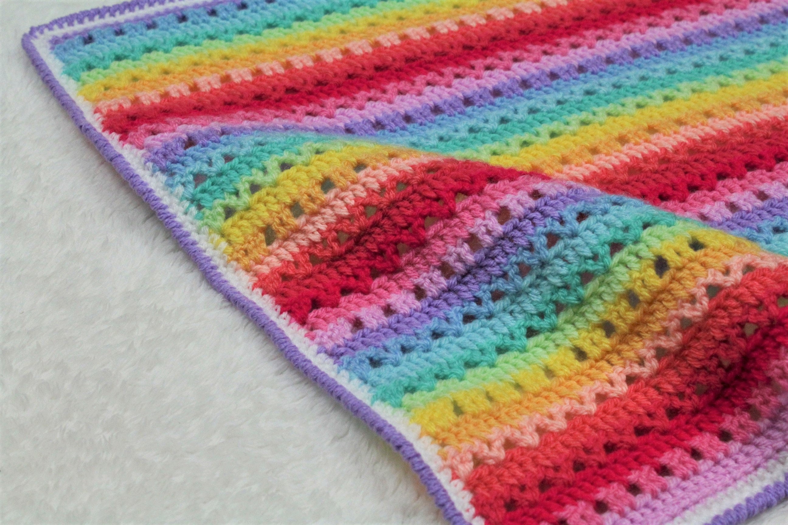40 Rainbow Blanket Crochet Patterns to Brighten Baby Rooms, Throws, and Gift Giving 11 Lucie Blanket: Crochet Rainbow Blanket
