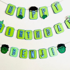May include: Green and blue banner with the words "Happy Birthday Benji!" and images of the Hulk. The banner is strung with silver string.