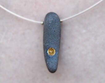 Unique jewellery_terra incognita_carved river stone_gold leaf