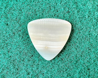 Seashell guitar pick/1.2mm thick, triangular shape... by BeachSidePicks.