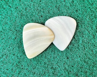 Two seashell guitar picks/1.3mm thick. Classic profile... by BeachSidePicks.