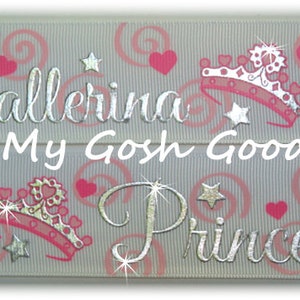 May include: White ribbon with a silver and pink ballerina and princess design. The ribbon has a repeating pattern of hearts, stars, and swirls. The text "Oh My Gosh Goodies" is printed on the ribbon.