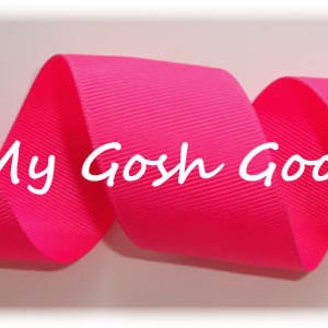 May include: A close-up of a bright pink ribbon, with the text "Oh My Gosh Goodies" printed on it.