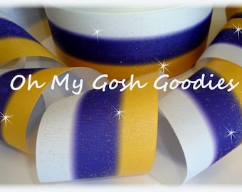 May include: White, purple, and gold striped ribbon with a glittery finish. The ribbon is 2.5 inches wide.