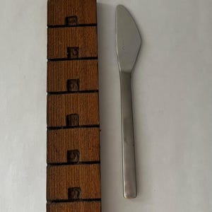 May include: A rustic wooden sign with the text "Welcome to our home" in white lettering. The sign features a distressed finish and a simple, inviting design, perfect for front door decor.