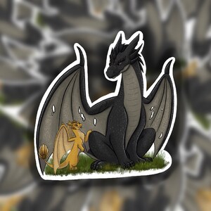 May include: A black dragon with gray wings sits with a smaller, yellow dragon with brown wings. The dragons are on a green grassy surface.