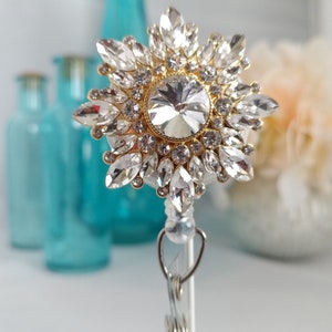 Aurora.  Brilliant Clear Rhinestones in a Golden Setting.