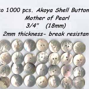 May include: A collection of 24 white mother of pearl buttons, each with two holes. The buttons are 3/4 inches in diameter and 2mm thick. The text on the card reads "12 to 1000 pcs. Akoya Shell Buttons Mother of Pearl 3/4" (18mm) 2mm thickness- break resistant".