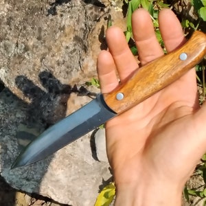 Made in Pa. Of pa  1095 high carbon steel  full tang honey locust wood handle.