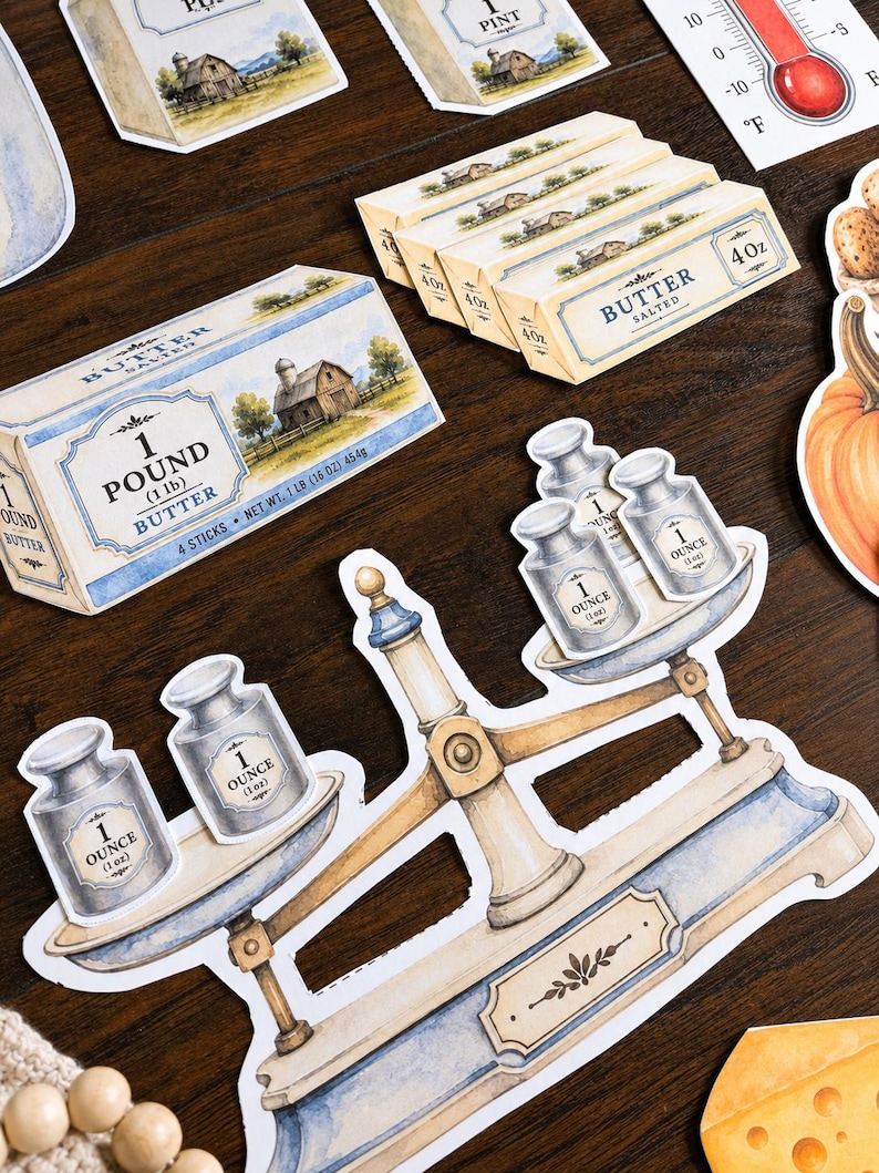 May include: A collection of die-cut stickers featuring a vintage balance scale with one-ounce weights, sticks of butter labeled 4oz and 1 pound, a thermometer, and a pumpkin. The illustrations use a watercolor style with blue and cream tones.