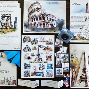 May include: A collection of watercolor paintings of famous landmarks around the world, including the Great Wall of China, Stonehenge, the Colosseum, the Eiffel Tower, and Angkor Wat. The paintings are displayed on a wooden surface with other related items, such as a book titled "My Book of Landmarks", a small camera, and a set of cards with images of landmarks.