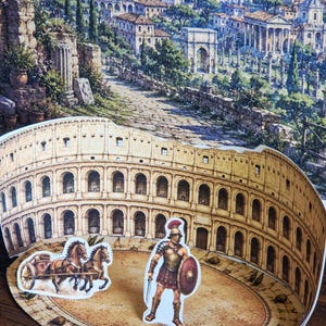 May include: A pop-up diorama of the Roman Colosseum with a detailed cityscape backdrop. The diorama features a gladiator with a shield and sword, and a chariot with two horses. The Colosseum is tan with arched windows.