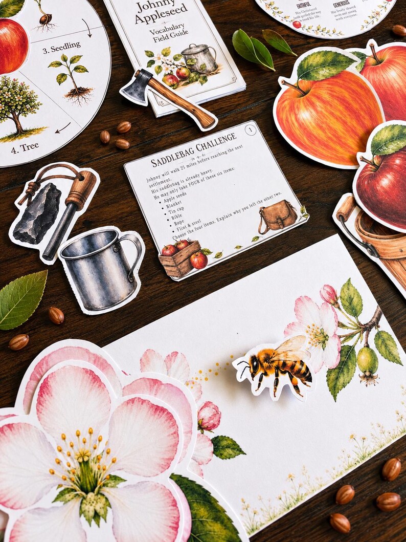 May include: A collection of educational paper cutouts featuring a Johnny Appleseed vocabulary guide, a saddlebag challenge card, red apple illustrations, a tin cup, an axe, a bee, and apple blossoms, all arranged with scattered brown seeds.
