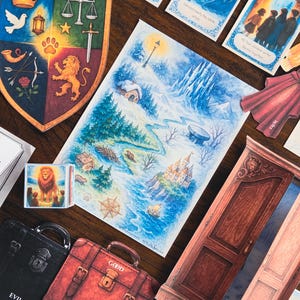 May include: A collection of illustrated cards and cutouts featuring a fantasy theme. Includes a map, a shield with symbols, suitcases labeled "EVIL" and "GOOD", and cards with text like "Lucy meets Mr. Tumnus".