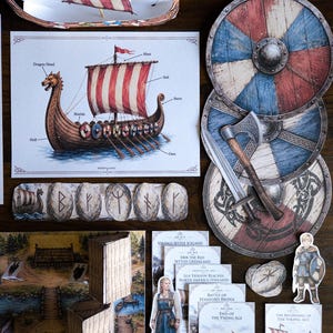 Op de afbeelding: Een verzameling Viking-thema papieren uitsparingen en illustraties. Bevat een Vikingschip, schilden, bijlen en figuren. Het kleurenpalet bevat rood, blauw en bruin, met gedetailleerde tekeningen en tekstelementen. De items zijn gerangschikt op een donker houten oppervlak.