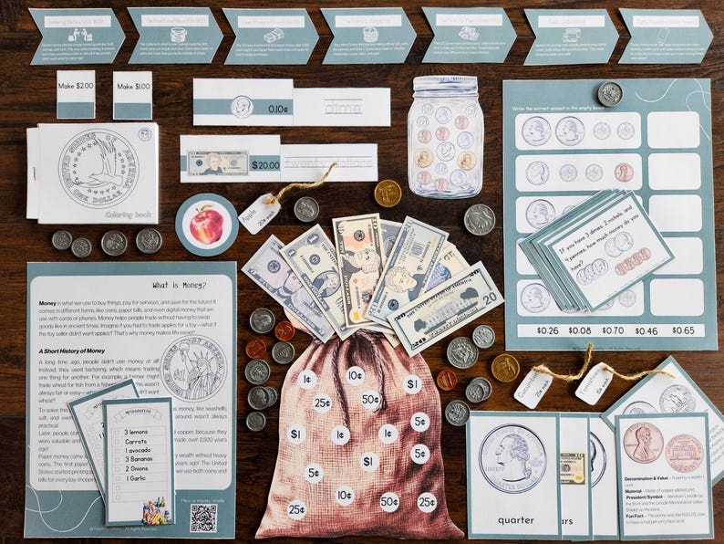 May include: An educational money learning kit featuring paper currency, various coins, a printed money bag, informational cards, and worksheets. The set includes illustrations of US coins and bills, math practice cards, and a history of money sheet.