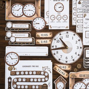 May include: A collection of educational clock-themed paper cutouts and game boards featuring various analog clock faces, digital time displays, and instructional text like Clockmaker's Time Race, Quarter To, and Half Past, arranged on a dark surface.