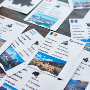 May include: A set of flashcards with information about different countries. Each card features a photo of a city, a map of the country, and text about the country's capital, population, currency, and language. The cards include information about Romania, Monaco, Argentina, and Armenia.