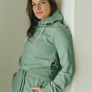 Viento Hoodie organic cotton hooded sweatshirt with a big hood and high neckline and deep pockets Aqua