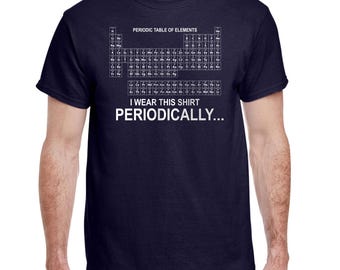 May include: Navy blue t-shirt featuring the periodic table of elements printed in white. The text "I wear this shirt periodically..." is below the table. A short-sleeved, crew neck shirt.