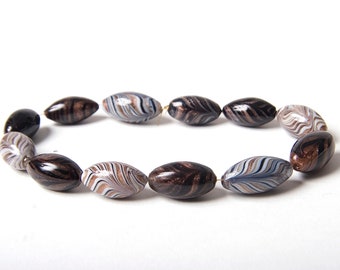 12 vintage Murano glass Venetian feather beads with aventurine swirls