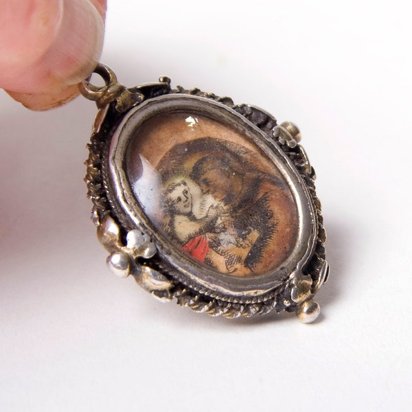 Late 16th early 17th century Spanish devotional pendant in silver frame, once gilded