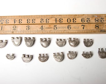 A set of 14 coin silver u shaped Ethiopian telsum beads
