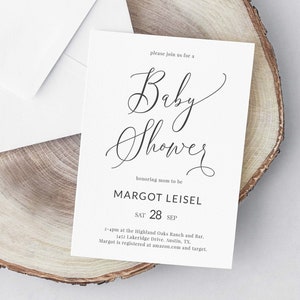May include: A white card with black text announcing a baby shower for Margot Leisel on September 28th. The text reads "Please join us for a Baby Shower honoring mom to be Margot Leisel Sat 28 Sep 2-4pm at the Highland Oaks Ranch and Bar, 3417 Lakeridge Drive, Austin, TX. Margot is registered at amazon.com and target."