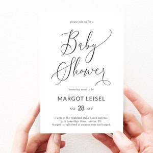 May include: A white baby shower invitation with black calligraphy text. The invitation reads "Please join us for a Baby Shower honoring mom to be Margot Leisel. Sat 28 Sep. 2-4pm at the Highland Oaks Ranch and Bar. 3452 Lakeridge Drive. Austin, TX. Margot is registered at amazon.com and target."