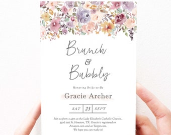 May include: A floral-themed invitation for a brunch and bubbly event honoring Gracie Archer. The invitation is set against a white background and features a watercolor floral border in shades of pink, purple, and yellow. The text "Brunch & Bubbly" is written in a cursive font, and the date "SAT 23 SEPT" is printed below. The invitation also includes the address of the event and information about the registry.