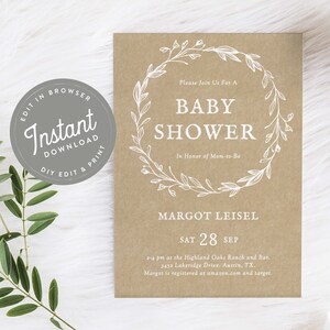 May include: A brown paper baby shower invitation with a white floral wreath and the text "Please Join Us For A Baby Shower In Honor of Mom-to-Be Margot Leisel Sat 28 Sep 2-4 pm at the Highland Oaks Ranch and Bar. 3452 Lakeridge Drive. Austin, TX. Margot is registered at amazon.com and target."
