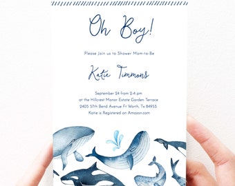 Op de afbeelding: Een babyborrel uitnodiging met een blauw en wit aquarel ontwerp met walvissen en de tekst "Oh Boy!"  Kom gezellig mee naar de babyborrel van Katie Timmons op 24 september van 14:00 tot 16:00 uur in de Hillcrest Manor Estate Garden Terrace, 2405 57th Bend Avenue Ft Worth, Tx 84953. Katie is geregistreerd op Amazon.com
